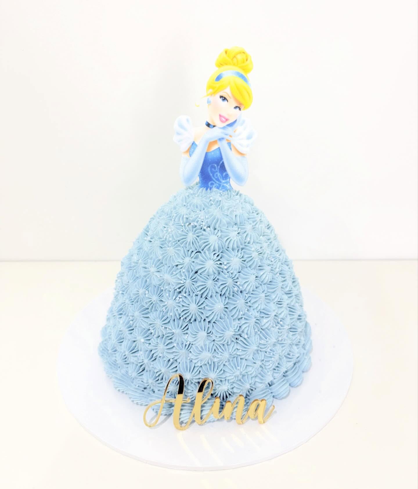 Blue princess cake with detailed piped floral icing